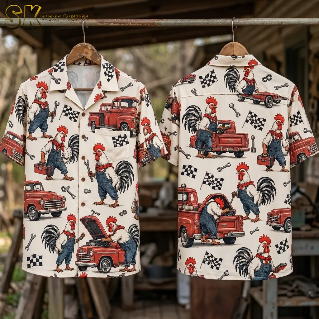 Front and back displays of a cream rooster Hawaiian shirt hang from wooden hangers on a metal rod in a workshop.
