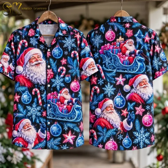 Front and back displays of a black Hawaiian shirt with Santa Claus hang on wooden hangers against a holiday-decorated background.