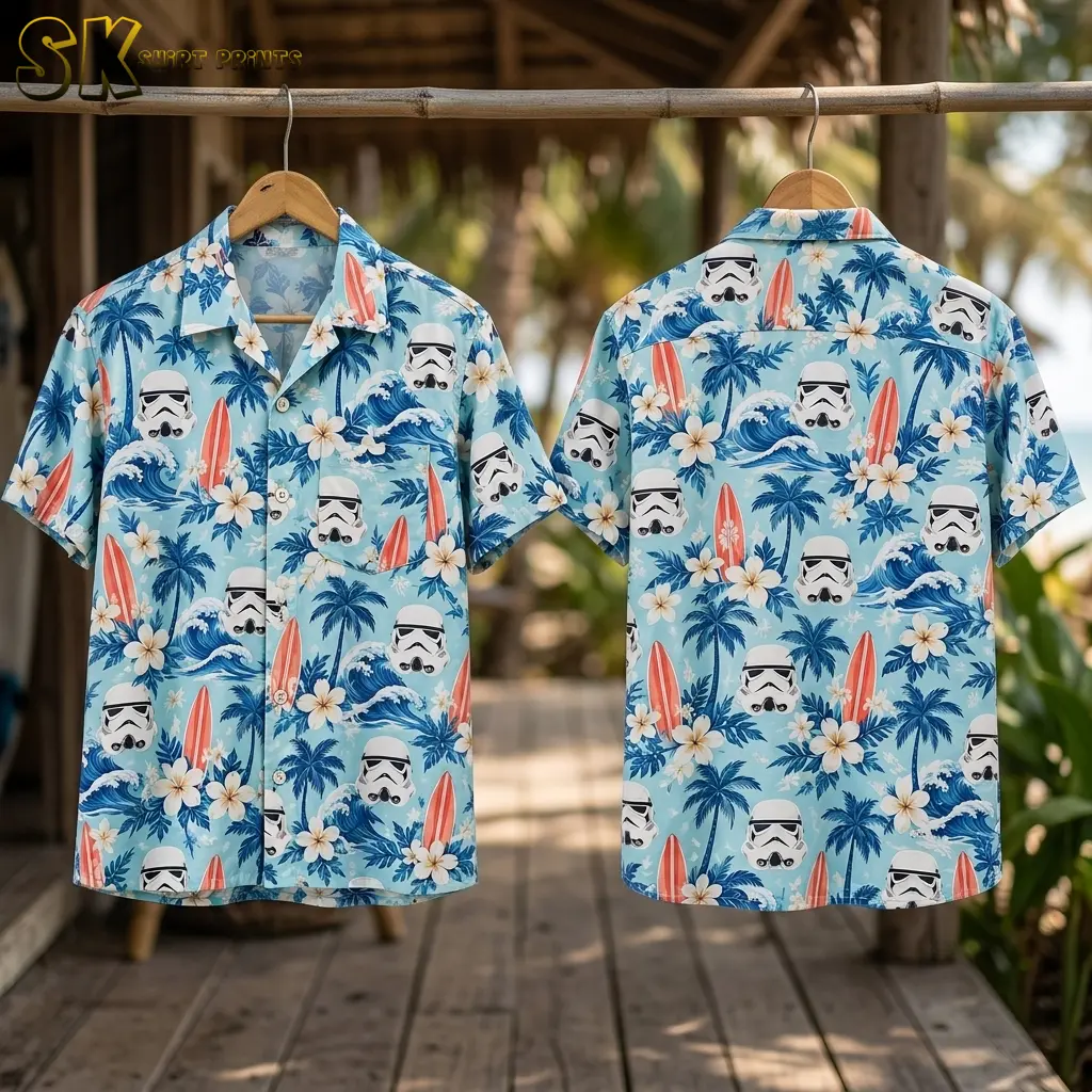 Front and back of a light blue Star Wars aloha shirt hang from a bamboo rail above a wooden deck.