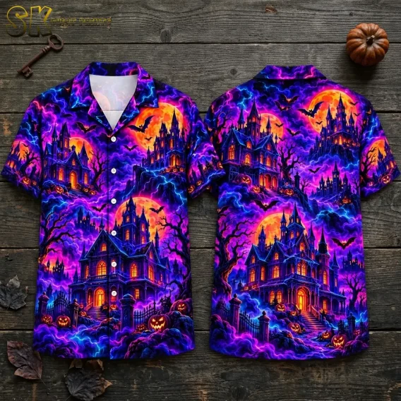 Front and back of a Halloween Hawaiian shirt lie on wooden boards, showing purple haunted mansions beneath orange moons.