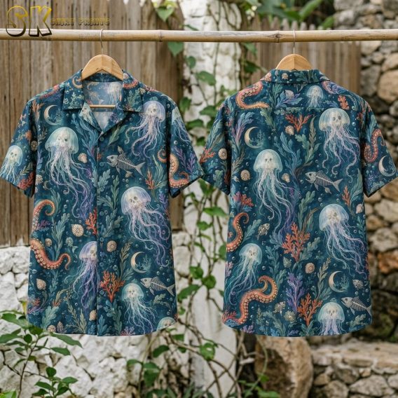 Flat-lay view of the shirt laid front and back, showing the full all-over pattern of jellyfish, fish skeletons, crescent moons, seashells, and orange octopus tentacles on a dark teal base.