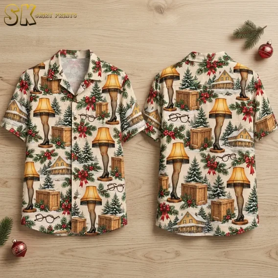 Front and back of a cream Christmas Hawaiian shirt laid on a wood surface, with leg lamps, snowy houses, and red bows.