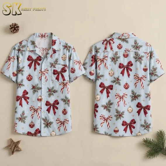 Front and back of a light blue Christmas themed Hawaiian shirt with red bows and ornaments, displayed against a beige background.