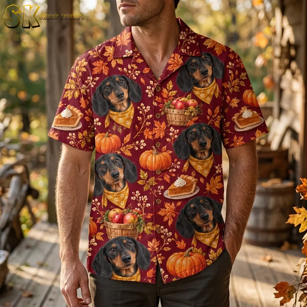 A man on a wooden porch wears a maroon Thanksgiving Hawaiian shirt with dachshunds in yellow bandanas and orange pumpkins.