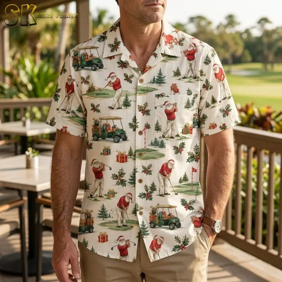 A man on a patio wears a cream Christmas Hawaiian shirt with golfing Santa illustrations and beige pants.