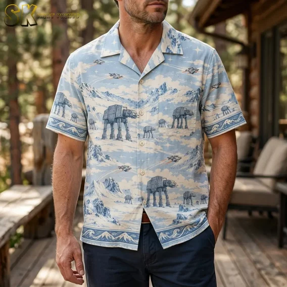 A man wears a light blue Star Wars Hawaiian shirt with dark pants on a wooden porch, with large walker illustrations across the front.