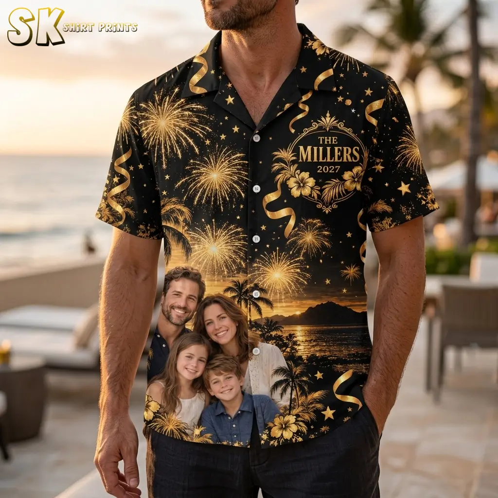 A man beside the beach wears a black and gold family New Year's shirt with “The Millers 2027” on the chest.