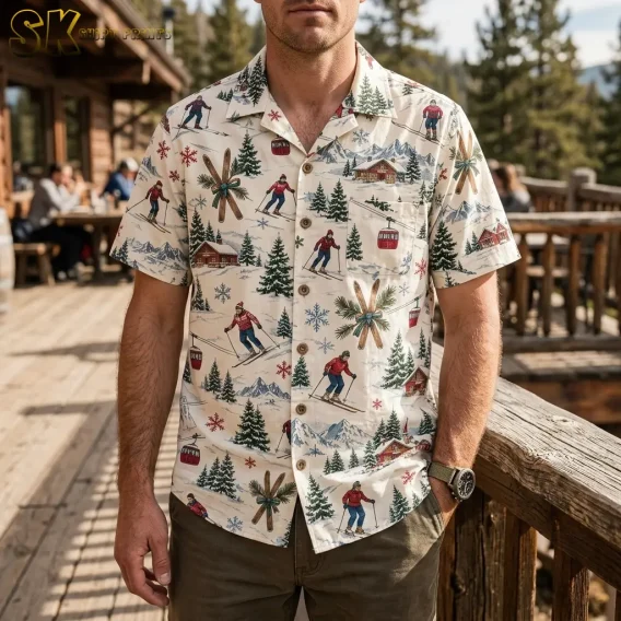 A man stands on a wooden deck outside a mountain lodge wearing the mens christmas hawaiian shirt, with the gondola cabin and crossed-ski motifs clearly visible across the chest.
