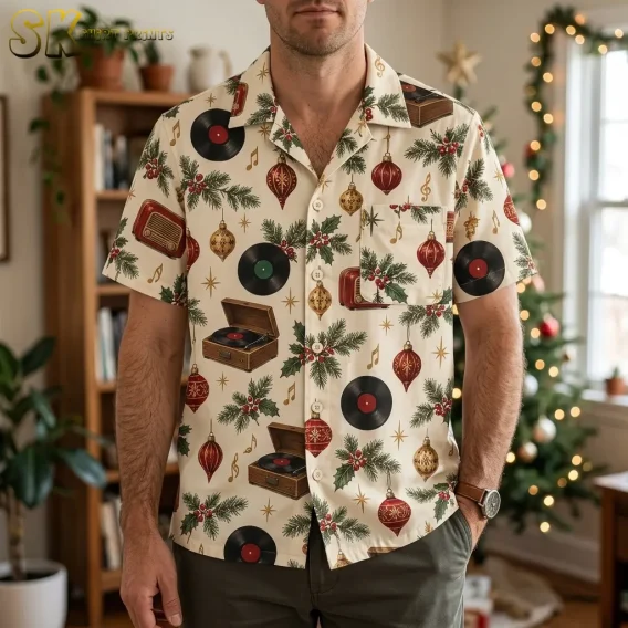 A man wearing a mens christmas hawaiian shirt stands in a decorated living room, with a Christmas tree visible behind him and the front chest pocket and camp collar clearly in view.