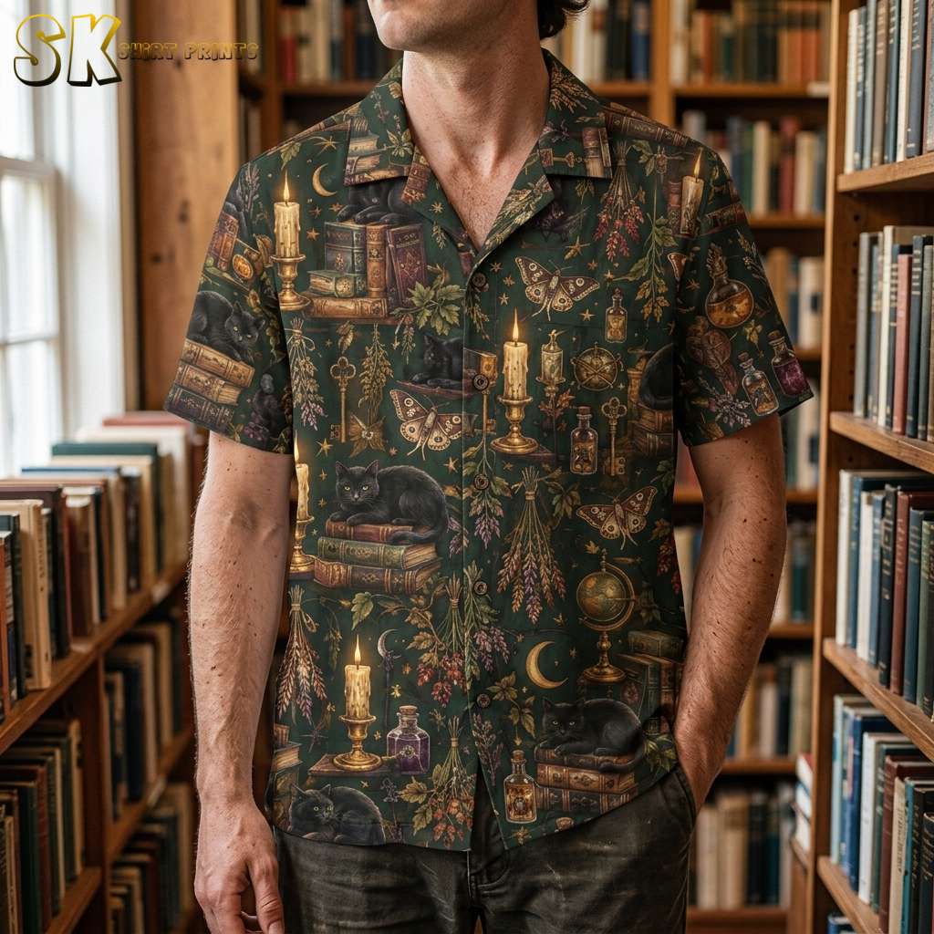 Man wearing a dark green mens halloween hawaiian shirt with black cats, candles, moons, and moth illustrations in a vintage apothecary pattern.