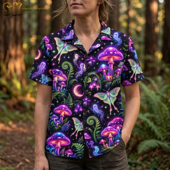 A close-up view of a woman wearing the black shirt, highlighting the neon-colored moths with pink wing accents and glowing dotted mushrooms in the print.