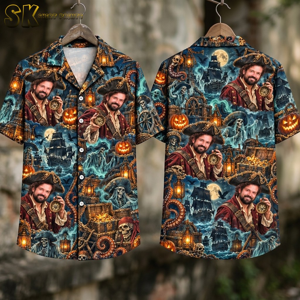 Flat lay showing the front and back of the dark blue short-sleeve shirt side by side, with the pirate ship, ghostly skeletons, treasure chests, tentacles, and bat motifs clearly visible across both panels.