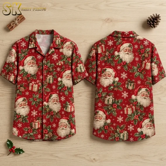 A red Santa Hawaiian shirt is laid flat front and back on a light wood surface, showing Santa faces, gifts, and snowflakes.