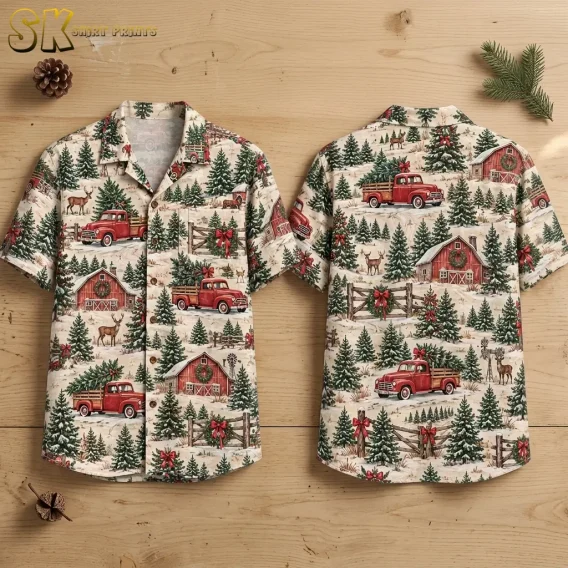 Front and back of a cream Christmas themed Hawaiian shirt laid on wood, with red pickup trucks and snowy evergreen scenes.