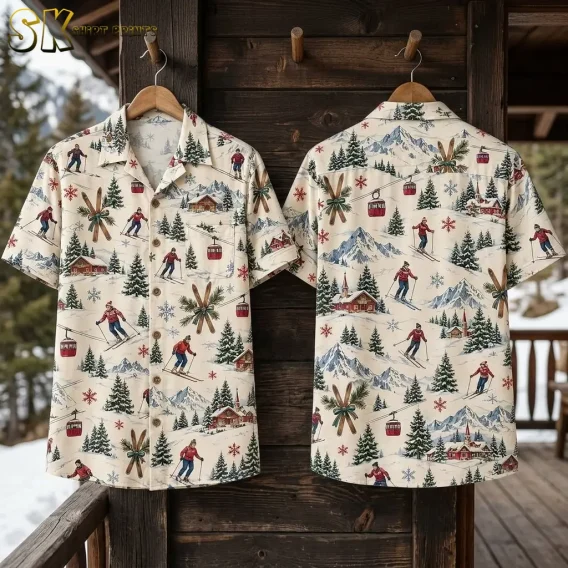 Front and back of the xmas hawaiian shirt hang side by side on wooden pegs outside a snow-dusted cabin, with mountain peaks visible behind and the repeat skier and snowflake pattern fully spread out.