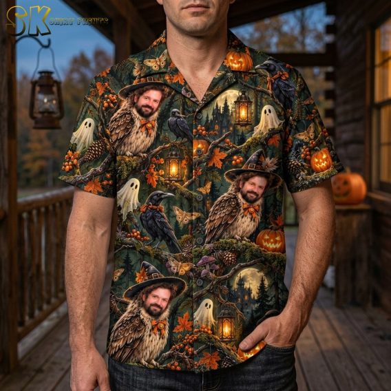 A man wearing the short-sleeve button-up shirt with the dark green and black owl-face Halloween print, shown in a lifestyle setting.