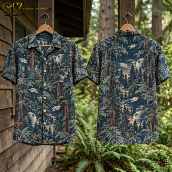 Front and back of the star wars hawaiian button up shirt hang on wooden hangers against a cabin exterior, displaying the full repeating pattern of redwood trees, ferns, a grid-patterned moon, and small starfighter silhouettes on both sides.