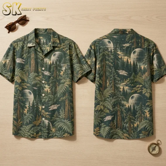 Front and back of a star wars hawaiian shirt displayed flat on a light wood surface, showing the all-over forest print with spherical space stations and flying ships repeated across both panels.