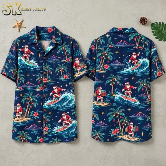 Front and back of a navy surfing Santa Hawaiian shirt laid flat beside a starfish and tropical leaf.