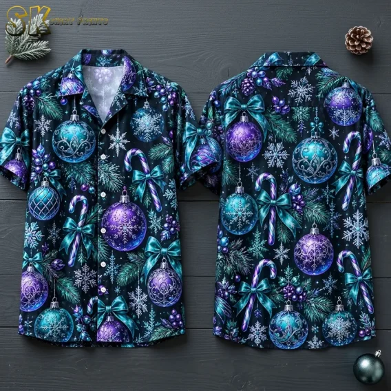 Front and back of a black short-sleeve shirt laid on dark wood, featuring teal and purple ornaments, candy canes, and snowflakes.