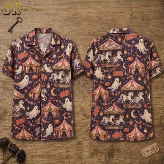 Front and back hanger view of a short-sleeve button-up shirt with a dark purplish-brown base, featuring an all-over pattern of carousel horses, striped circus tents, and smiling ghosts alongside jack-o'-lanterns and crescent moons.