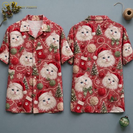 Both sides of a red christmas hawaiian shirt displayed on an invisible hanger, showing fluffy white cats in Santa hats and green bows surrounded by yarn balls, snowflakes, and paw-print stockings across the full pattern.