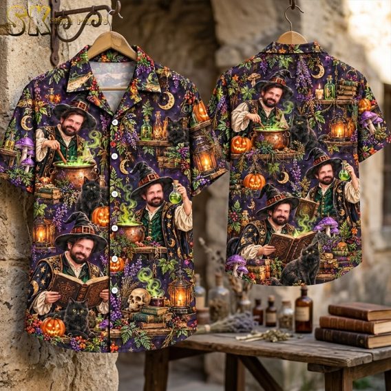 Flat-lay front and back view of the dark purple short-sleeve button-up shirt spread out to show the dense all-over pattern of the wizard in multiple poses alongside black cats, pumpkins, cauldrons, and moon and star ornaments.