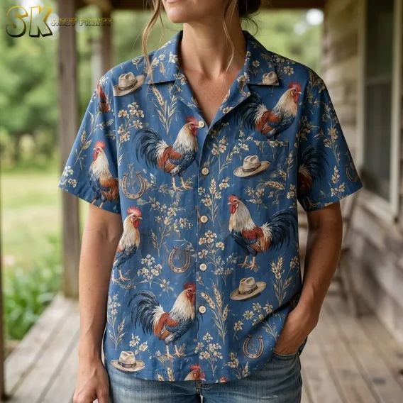 A woman wears a blue rooster Hawaiian shirt with jeans, showing the collar, chest pocket, and horseshoe print in close-up.