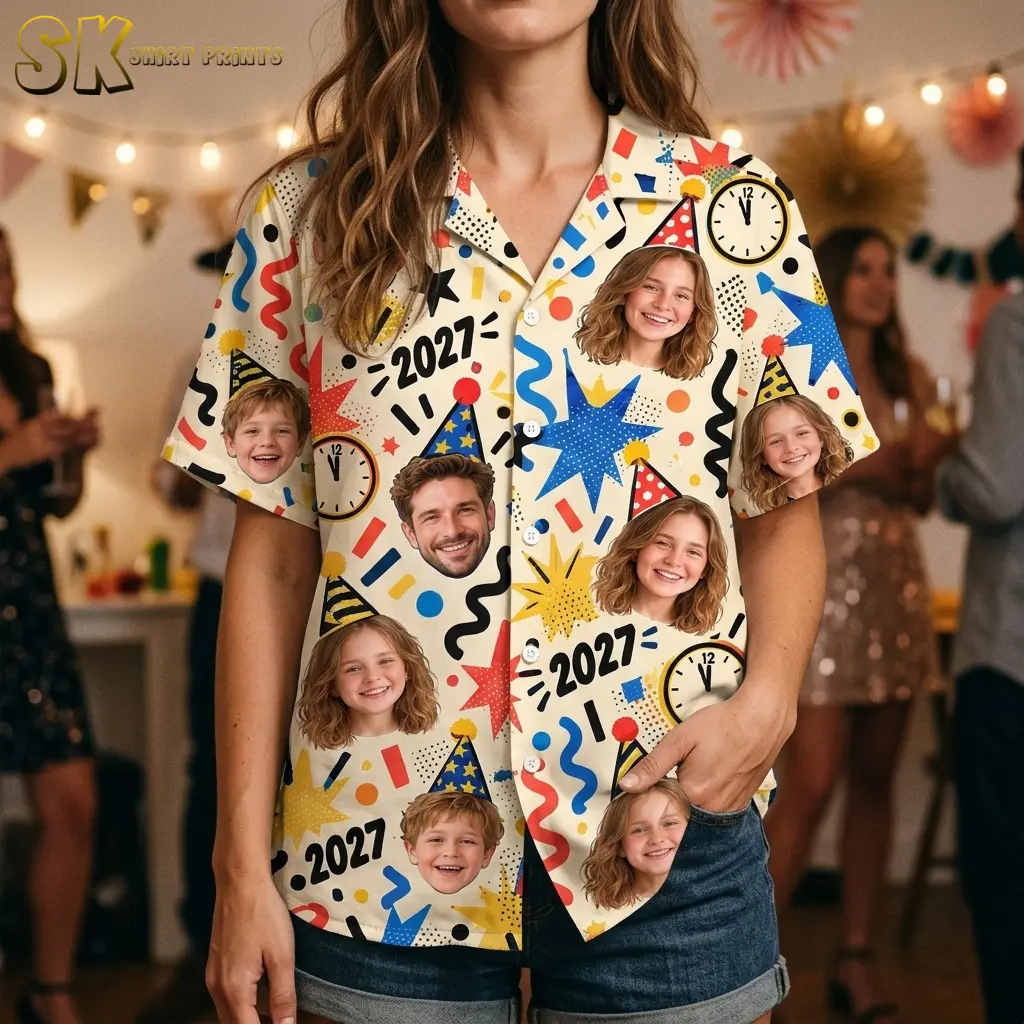 A woman wears the cream portrait-print shirt with denim shorts, showing its collar, white buttons, and bright blue starburst detail.