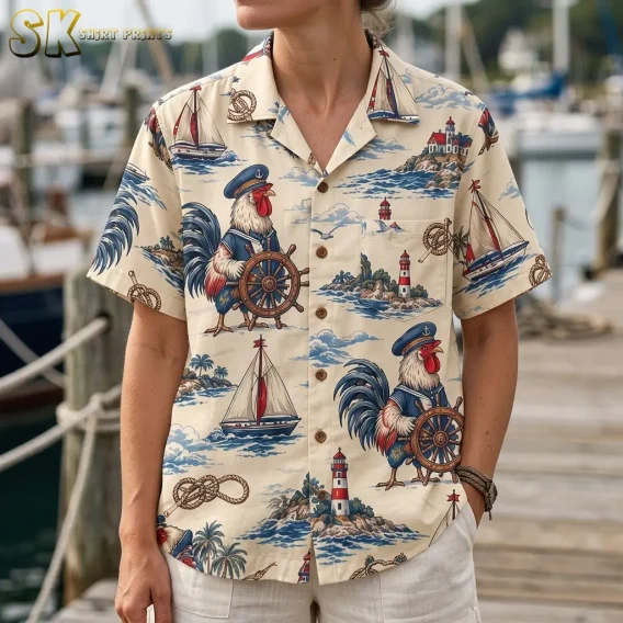 A woman wears a cream rooster Hawaiian shirt with white shorts, showing a chest pocket printed with a red-and-white lighthouse.