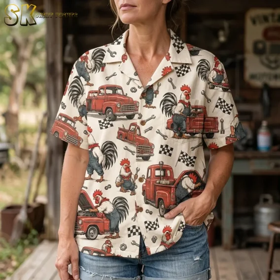 A woman wears a cream rooster-print button-up with denim shorts, showing its collar, chest pocket, and checkered flag details.