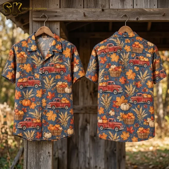 Front and back displays of a pumpkin truck shirt hang on wooden hangers from a weathered wooden beam.